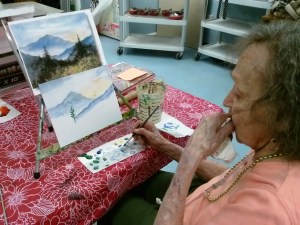 Miss Charlotte painting a landscape
