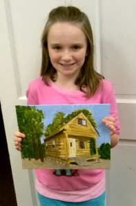 Sam with completed cabin paiting