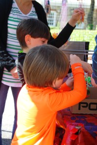 Boys making necklaces