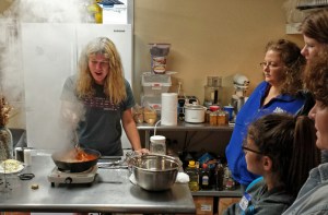 Suzanne demonstrating how to "burn" sugar for the cake