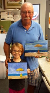 Maddie and Granddaddy (Jim) with their finished paintings