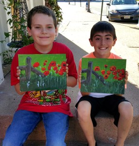 Ethan and Jacob with Poppies along the Fence