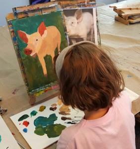 Sophia working on Pig painting